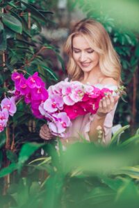 Woman Happy with Orchild Arrangement